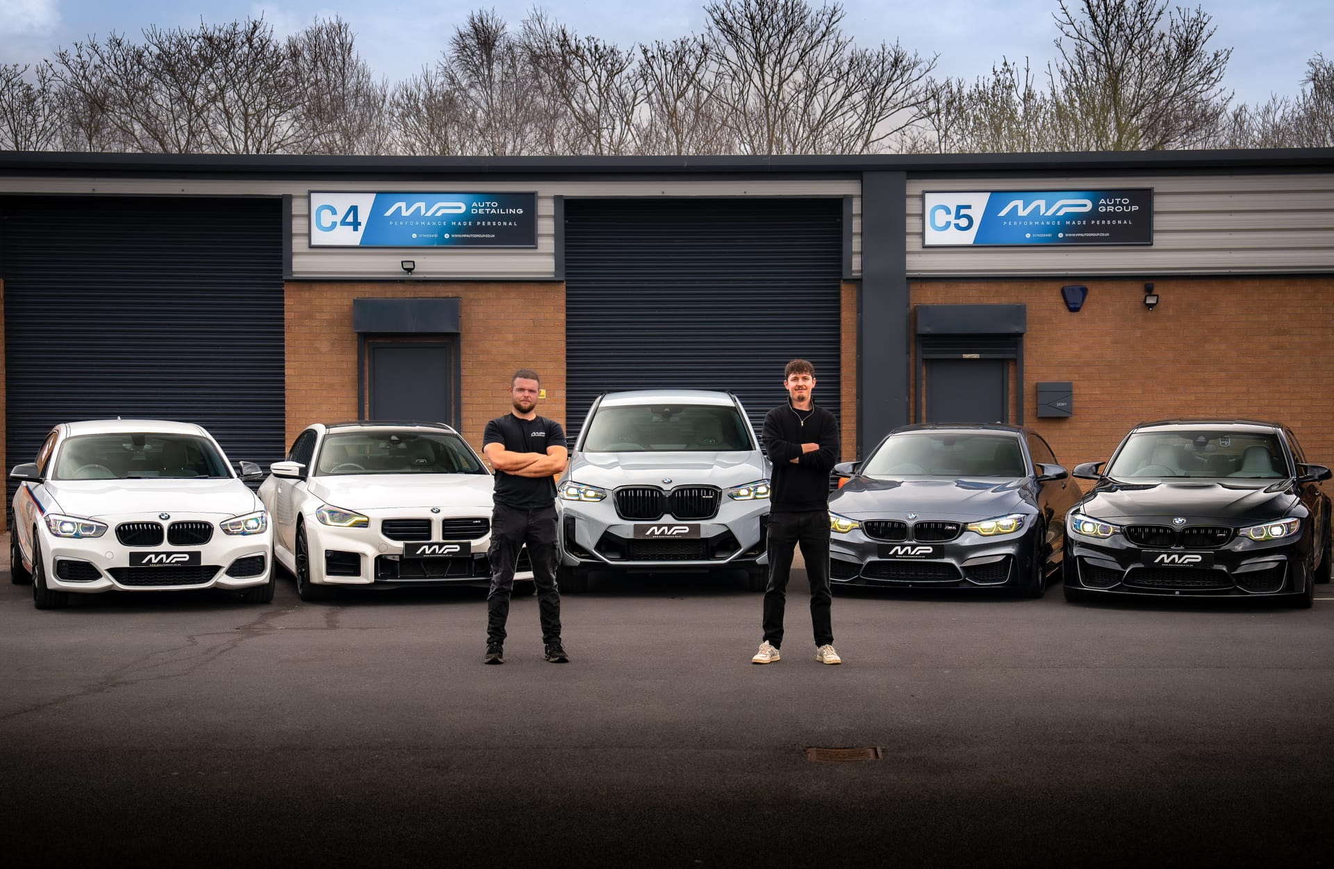 The MP Auto Group team with the lineup outside the unit